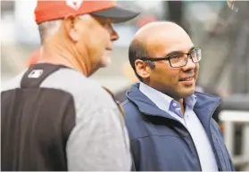  ?? Scott Strazzante / The Chronicle ?? Farhan Zaidi, the Giants’ firstyear president of baseball operations, and pitching coach Curt Young (left) parted with three majorleagu­e arms at the trade deadline. But they kept the biggest arm, that of Madison Bumgarner, and added young players.