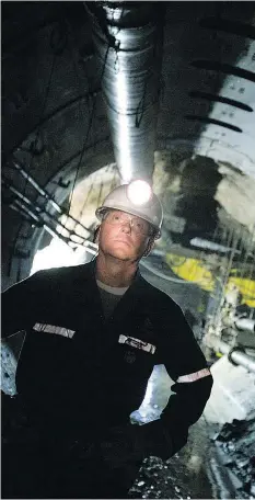  ?? GEOFF HOWE/BLOOMBERG FILES ?? Douglas McIlveen, former chief geologist at Cameco Corp.’s Cigar Lake uranium mine, surveys a mine shaft in northern Saskatchew­an. The company recently closed some operations.