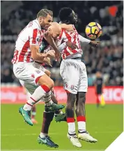  ??  ?? ■ Stoke’s Erik Pieters and Mame Diouff sandwich West Ham’s James Collins.