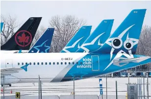  ?? PAUL CHIASSON THE CANADIAN PRESS FILE PHOTO ?? Air Canada’s decision not to extend the transactio­n date of a deal with Transat comes as the airline industry suffers from a lack of travel demand during the COVID-19 pandemic.