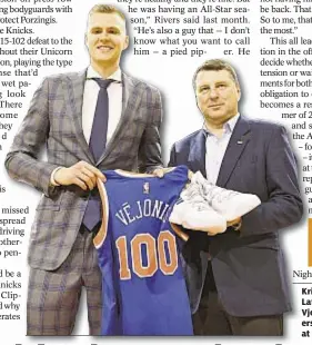  ?? GETTY ?? Kristaps Porzingis presents Latvian President Raimonds Vjonis with jersey and sneakers on Latvian Heritage Night at the Garden.