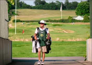  ?? Photo courtesy Daniel Smith ?? Central Catholic and Penn State grad Daniel Smith fulfills caddie duties at Oakmont Country Club. Smith, who won a par-4 design challenge presented by Golf Magazine and Jack Nicklaus’ design company, is an aspiring golf course architect.