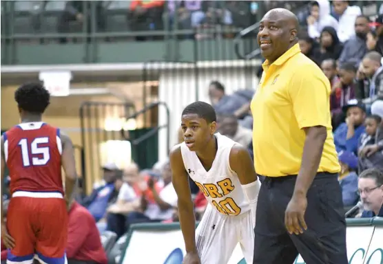  ?? | WORSOM ROBINSON/ FOR THE SUN- TIMES ?? Orr coach Lou Adams, having a word with senior point guard Chase Adams, is proud of how far the basketball program has come.