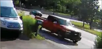  ?? SURVEILLAN­CE IMAGE ?? This image released by West Goshen Police shows a red pickup truck believed to be involved in a fatal road rage shooting in Chester County. Police now believe the truck was spotted driving on Route 352 into Delaware County.