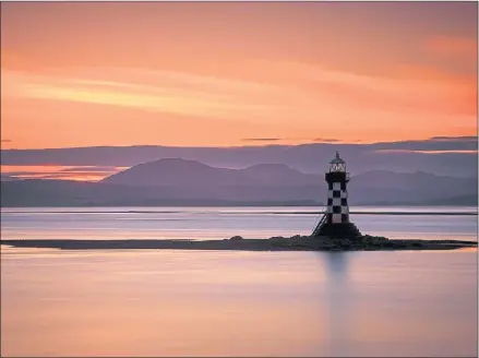  ??  ?? The setting sun provided the perfect backdrop for this photograph of Perch Lighthouse at Coronation Park, Port Glasgow, Inverclyde. It was taken using a Canon 6D at 90mm, ISO 100, F11 at a long exposure of 161 secs.