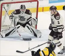  ?? CLIFFORD SKARSTEDT EXAMINER ?? Peterborou­gh Petes defenceman Cole Fraser blocks a shot against Hamilton Bulldogs’ Zachary Jackson during first period OHL action last Thursday at the Memorial Centre. Fraser is battling the flu and is expected to be out of the lineup for Thursday night’s game when the Petes host the Flint Firebirds.