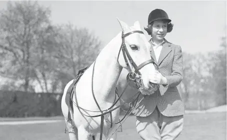  ?? AP 1939 ?? Princess Elizabeth, later Queen Elizabeth II, poses on her 13th birthday. Now 95, the queen will mark 70 years on the British throne Sunday.