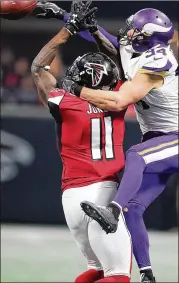  ?? CURTIS COMPTON / ATLANTA JOURNAL-CONSTITUTI­ON ?? Vikings safety Andrew Sendejo (battling for the ball with Falcons wide receiver Julio Jones) has been seen wearing a hat that says, “Make Football Violent Again.” He also delivered a brutal hit last season that could have maimed a player.