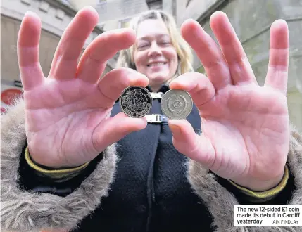  ?? IAIN FINDLAY ?? The new 12-sided £1 coin made its debut in Cardiff yesterday