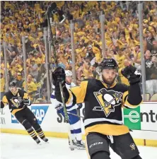  ?? DON WRIGHT, USA TODAY SPORTS ?? Teammate Ben Lovejoy says of Bryan Rust, celebratin­g the first of his two goals Thursday, “His speed is incredible.”