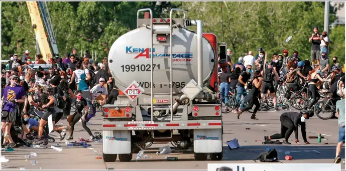  ??  ?? A truck heads into the crowd before the driver, right, is beaten up and handed over to police