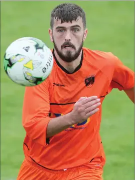  ??  ?? Hazel Lane’s Shane McCormack keeps his eye on the ball against Redeemer.