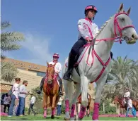  ?? Photos by M. Sajjad ?? Reem BinKaram with Dr Sawsan Al Madhi and Badr Al Juaidi during the announceme­nt of the 8th edition of the Pink Caravan Ride at Al Majaz Waterfront in Sharjah on Monday. Right, Pink Caravan Ride volunteers who are part of the annual cancer awareness...