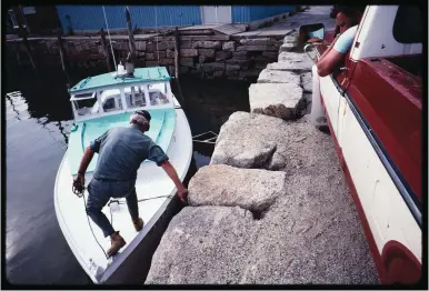  ??  ?? Keeping an eye on an older fella, boarding from the bulkhead. Fishermen looked out for one another, even if they weren’t all friends.