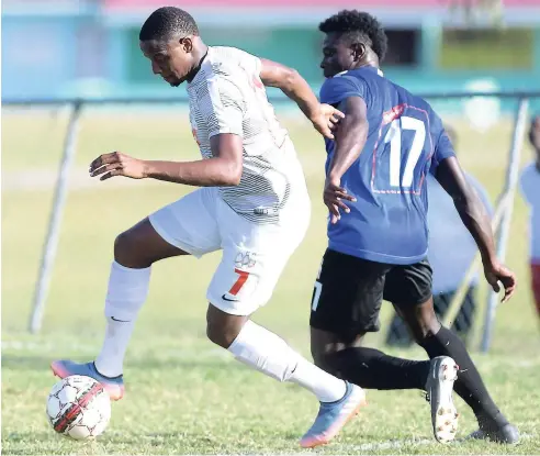  ?? FILE ?? Ryan Miller (left) playing for UWI FC against Cavalier SC in the Red Stripe Premier League in March.