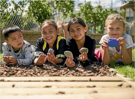  ?? PHOTO: DAVID UNWIN/STUFF ?? Central Normal School pupils, from left, Logan Hayton, 5, Mairangi Iwikau, 9, Azalea Lieu,10, and Aniwa Sands, 8.