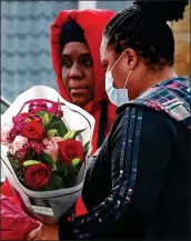  ??  ?? DEVASTATED: Relatives of the victim at the scene of his stabbing in Croydon