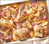  ?? JULIA GARTLAND NYT ?? Easy, festive sheet-pan chicken with roasted plums is bursting with spiced, seasonal fruit.