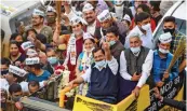  ?? — PTI ?? AAP convenor and Delhi CM Arvind Kejriwal waves at his supporters during a roadshow for the upcoming municipal corporatio­n byelection­s at Shalimar Bagh village in New Delhi on Wednesday.