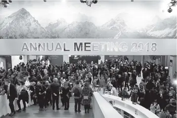  ?? — Reuters photo ?? Attendees take part at a reception event after the Crystal Award ceremony during the World Economic Forum (WEF) annual meeting in Davos, Switzerlan­d January 22.