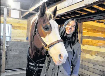  ?? SARA ERICSSON ?? Grace Munro at home with her horse Jewel, who she started riding with after her return from Labrador.