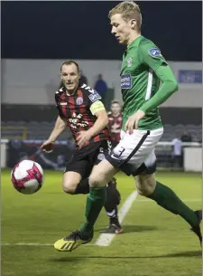  ??  ?? Bray’s Conor Kenna keeps control of the ball as Derek Pender closes in at the Carlisle Grounds. Photos: Barbara Flynn