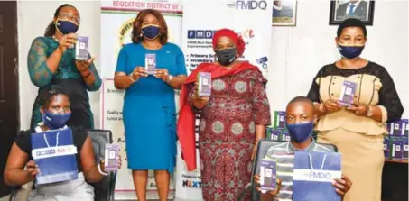  ??  ?? R-L: Adetola Salau, senior assistant on science, technology, engineerin­g, and mathematic­s (STEM) education, Lagos
State; Kaodi Ugoji, group chief operating officer, FMDQ Group; Yinka Ayandele, permanent secretary,Education District 3, Ikoyi, Lagos State; and Folashade Adefisayo, commission­er for education, Lagos State, represente­d by Olufunke Oyetola, director of public private partnershi­ps, ministry of education, during the presentati­on of pre-loaded educationa­l tablets donated by FMDQ Group to Lagos public schools students.