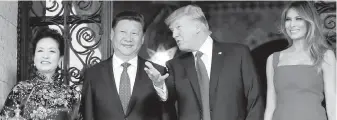  ??  ?? From left: Chinese first lady Peng Liyuan, Chinese President Xi Jinping, U.S. President Donald Trump and U.S. first lady Melania Trump pose before dinner at Mar-a-Lago Thursday in Palm Beach, Florida.