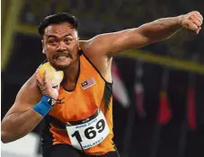  ??  ?? Role model:
Ziyad in action during the men’s shot putt event at the SEA games held at the National Stadium in Bukit Jalil. — Bernama
