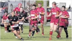  ?? Picture: Steve Lewis ?? Caernarfon in action at Llandudno (darker strip)