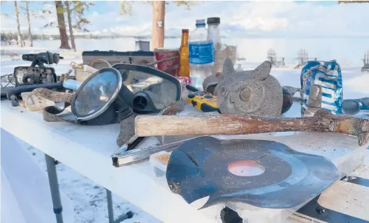  ?? HAVEN DALEY/AP ?? Examples of the debris and garbage retrieved during the yearlong Lake Tahoe cleanup are displayed on May 10 in Stateline, Nevada.