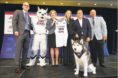  ?? Richard Drew / Associated Press file photo ?? University of Connecticu­t men’s basketball coach Dan Hurley, left; University President Susan Herbst, third left; Big East Commission­er Val Ackerman, fourth left; women’s basketball coach Geno Auriemma, fifth left, and Director of Athletics David Benedict, during the announceme­nt that the University of Connecticu­t is re-joining the Big East Conference, at New York's Madison Square Garden on June 27, 2019.