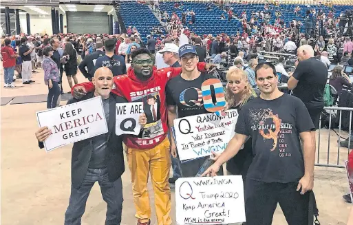 ?? KIRBY WILSON TAMPA BAY TIMES ?? Donald Trump supporters who are proponents of the “QAnon” conspiracy theory attended a Trump rally in Tampa Bay, Fla., last July.
