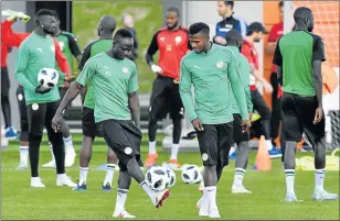  ?? Picture: AFP ?? KEEPING IN STEP: Senegal players including forward Sadio Mane, left, take part in a training session in Kaluga. Coach Aliou Cisse says his men must up their game against Colombia today