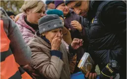  ?? BERNAT ARMANGUE/AP ?? An elderly woman reacts after receiving food donations Thursday from World Central Kitchen in Kherson, a port city liberated earlier this month in southern Ukraine.