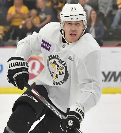  ?? Peter Diana/Post-Gazette ?? Evgeni Malkin will spend training camp beginning to develop chemistry with his new linemates. Friday, he skated with two new Penguins, Alex Galchenyuk and Brandon Tanev.