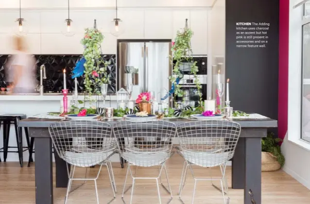  ??  ?? KITCHEN The Adding kitchen uses charcoal as an accent but hot pink is still present in accessorie­s and on a narrow feature wall.