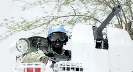  ?? KENZO TRIBOUILLA­RD/AFP/GETTY IMAGES ?? A UN soldier patrols the northern Malian city of Kidal in this file photo.