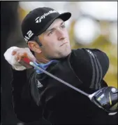  ?? ERIC GAY/THE ASSOCIATED PRESS The Associated Press ?? Jon Rahm follows through on his shot from the first tee Saturday during quarterfin­al play in the Dell Technologi­es Match Play tournament at Austin Country Club.