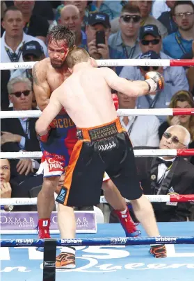  ?? AP FOTO ?? HEAD ON. Jeff Horn and Manny Pacquiao clash heads again late in the fight.