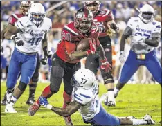  ?? AUSTIN ANTHONY / AP ?? Western Kentucky’s Anthony Wales (20) gained 329 yards from scrimmage, and the Hilltopper­s won a bowl for a third straight year Tuesday in the Boca Raton Bowl. They beat Memphis 51-31.