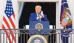  ?? ALEX BRANDON/ASSOCIATED PRESS ?? President Donald Trump removes his face mask to speak from the Blue Room Balcony of the White House to a crowd of supporters, Saturday in Washington.