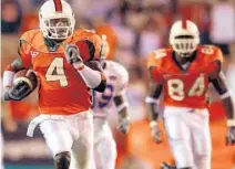  ?? SUN SENTINEL ?? UM’s Devin Hester returns the opening kickoff back for a touchdown against Florida in 2003.