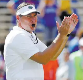  ?? John Raoux ?? The Associated Press Florida coach Dan Mullen encouragin­g players before a Sept. 15 home game vs. Colorado State.