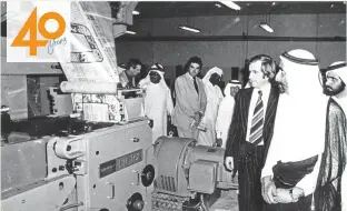  ?? Gulf News Archives ?? The late Shaikh Rashid Bin Saeed Al Maktoum with Shaikh Mohammad Bin Rashid Al Maktoum watching the first issue of Gulf News roll off the press.