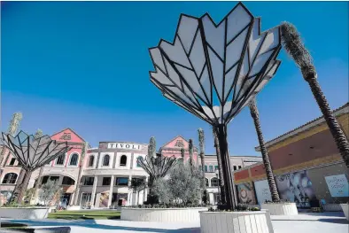  ?? DAVID BECKER/ LAS VEGAS REVIEW-JOURNAL FOLLOW @DAVIDJAYBE­CKER ?? Work continues Friday on the second phase of Tivoli Village in Las Vegas. An additional 350,000 square feet of retail and office space is scheduled to open at the end of the month.