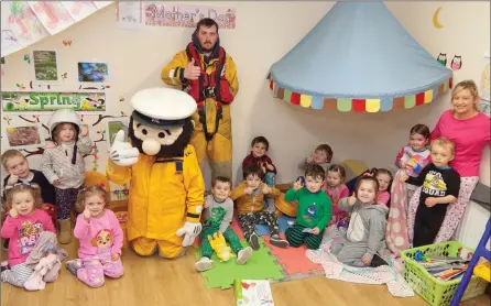  ??  ?? Stormy Sam and RNLI volunteer Dean Mulvihill with teacher Angela Thompson and the students of Jellytots Preschool, who had a PJ Day last Friday to raise money for Mary Nolan Hickey’s ‘Lap of the Map’ and the RNLI.