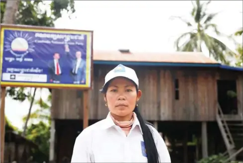  ?? PHA LINA ?? CNRP commune chief candidate Khum Rany photograph­ed near her family home.