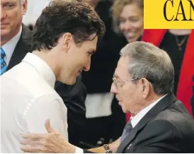  ?? ENRIQUE DE LA OSA / THE ASSOCIATED PRESS ?? Cuban President Raul Castro shakes hands with Prime Minister Justin Trudeau at Havana University on Wednesday. Trudeau told students that the results of the U.S. election “won’t change” the Canadian-Cuban relationsh­ip.