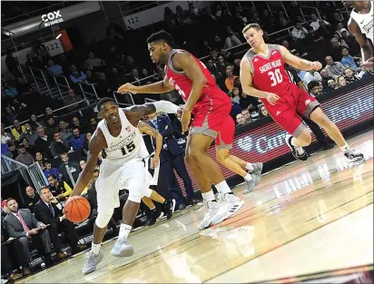  ??  ?? After dealing with health issues that have sidelined him for the last two seasons, Providence College forward Emmitt Holt (15) came off the bench to deliver 16 points, including a pair of 3-pointers, in Tuesday’s blowout win over Sacred Heart.